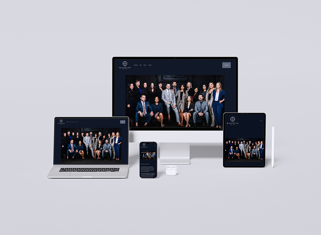 Group of professionals in business attire posing together, displayed on multiple devices including a desktop, laptop, tablet, and smartphone, showcasing a modern website design.
