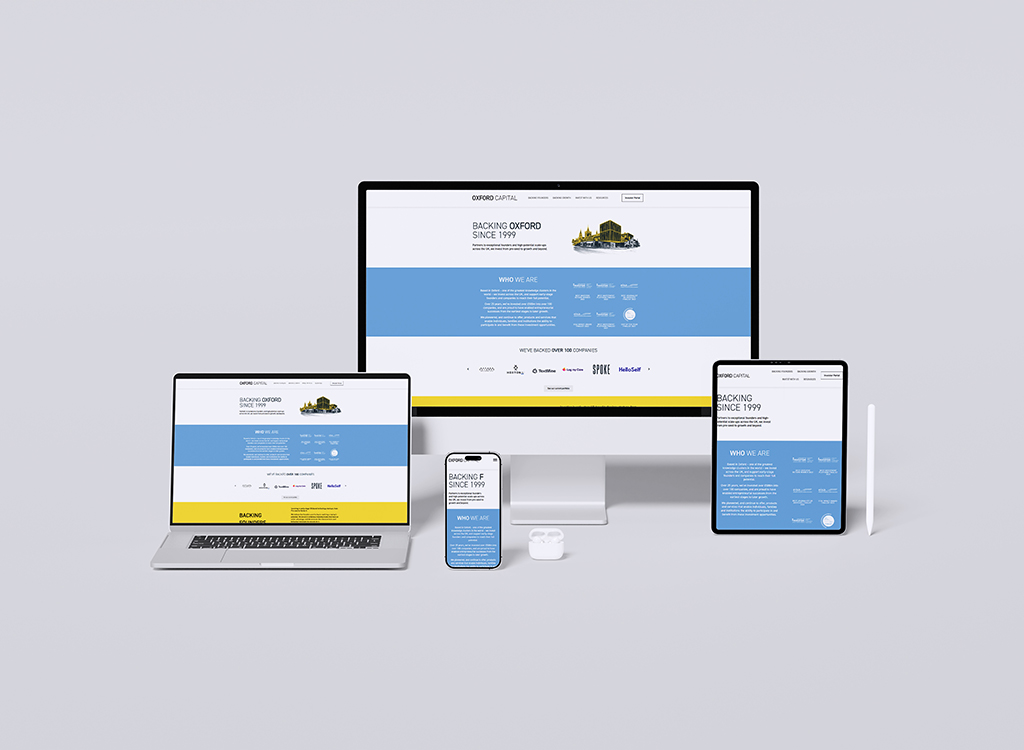 Responsive website design displayed on multiple devices, including a desktop monitor, laptop, tablet, and smartphone, showcasing the Oxford Capital homepage with sections about the company and its services.