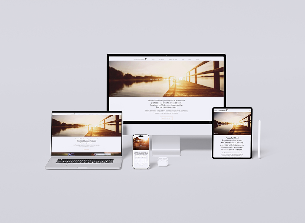 Image showcasing multiple devices displaying the website for Peaceful Mind Psychology, featuring a serene background of a pier at sunset. The devices include a desktop, laptop, tablet, and smartphone, highlighting the responsive design of the website aimed at providing mental health services in Melbourne.
