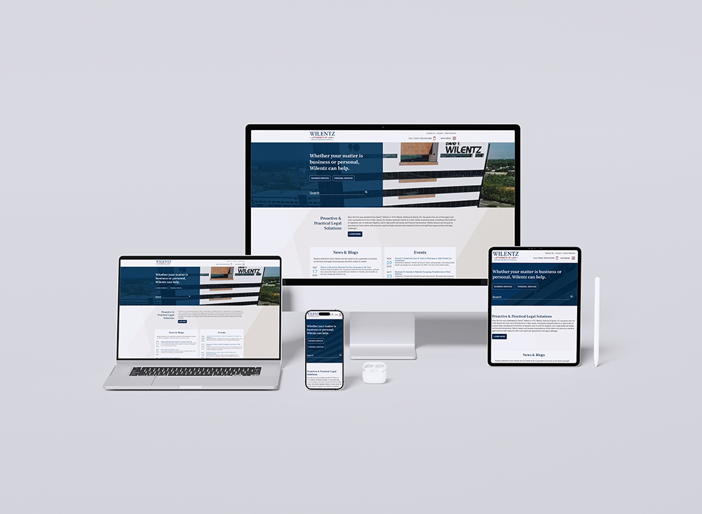 Mockup of responsive website design for Wilentz, showcasing the homepage on a desktop, laptop, tablet, and smartphone, emphasizing legal services and user-friendly navigation.